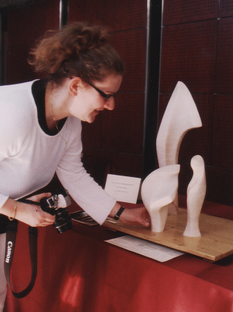 Art historian Karin Haanappel with artworks by Jeanne